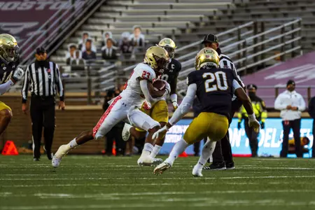 Travis Levy carries the ball vs. Notre Dame
