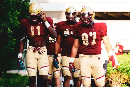 The defensive line walks into the Fish Field House ahead of a preseason practice on Aug. 10, 2020.