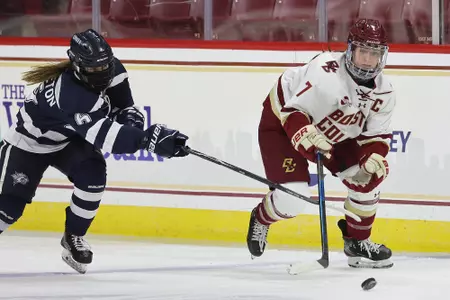 Maegan Beres rushes the puck up the ice.