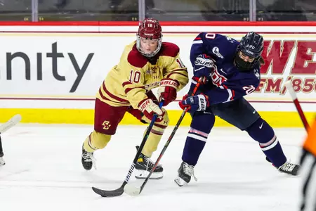 Caroline DiFiore battles for the puck.