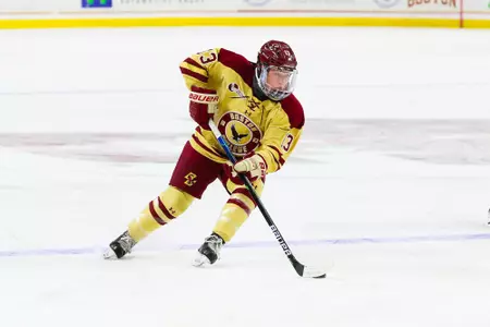 Jillian Fey rushes the puck up the ice.