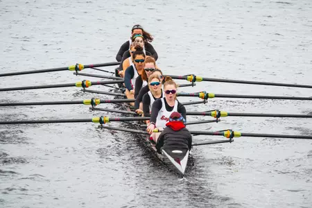BC's Third Varsity Eight boat rows on the Charles.