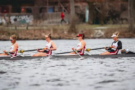 An Eagles four-person boat on the Charles River.