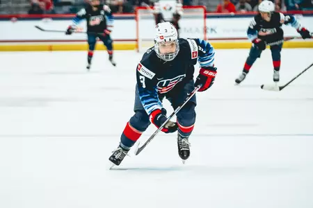 Cayla Barnes skates up the ice while competing for Team USA.