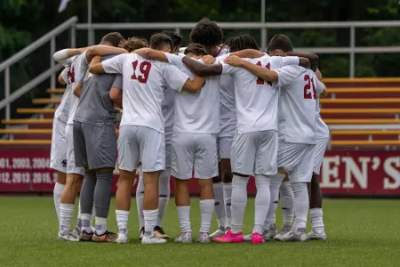 Men's soccer huddles before its home opener 