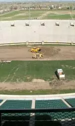 Crews began tearing up existing turf from Hughes Stadium Monday.