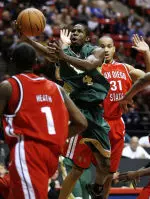 Cory Lewis shoots in the lane against San Diego State defenders. (AP Photo/Denis Poroy)