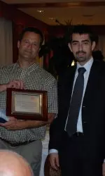 Coach Hilbert receives an award from the Settimo Torinese Deputy Mayor of Sport