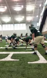 Offensive line participates in drills during Friday's practice.