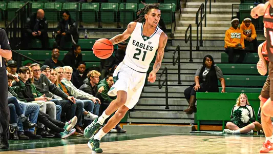Emoni Bates pushes paces down the court for EMU against Bowling Green