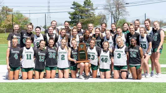 2025 MAC Championship team with trophy 