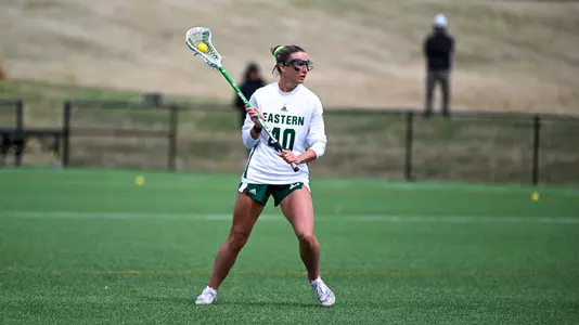 Emma Reichert holds the ball as she surveys the offensive zone in a home game against Kent State