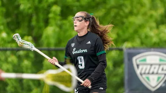 Kelsea Dague cradles the ball and surveys the defense as she prepares her next move toward the goal