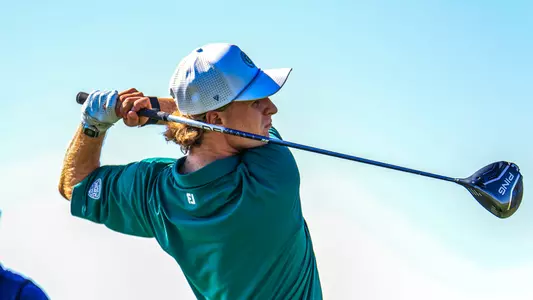 Joshua Hess holds his backswing after hitting his driver off the tee