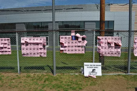 The softball team sold pink paper bats for $2 to benefit Gloria Gemma Breast Cancer Foundation