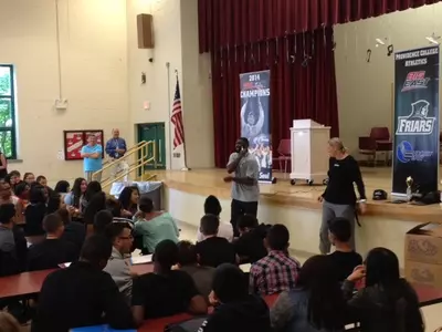 Susan Robinson Fruchtl and God Shammgod at DelSesto Middle School.