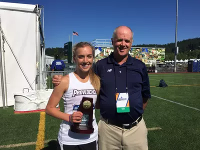 Emily Sisson and Head Coach Ray Treacy are pictured after Sisson's title in the NCAA Outdoor 5,000 meter championship.