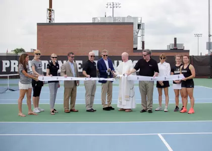 Women's Tennis Facility ribbon cutting featuring special guests including Bob Driscoll, Father Stanley and John Sweeney