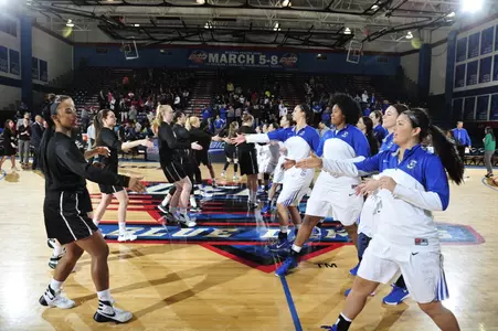 Women's Basketball Group Photo featuring the pregame handshake between Providence College and Creighton during the BIG EAST Tournament
