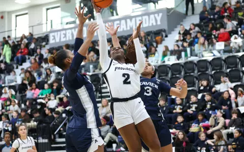 Grace Efosa goes up for a layup against two Xavier defenders