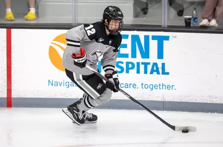 MIH-Nick Poisson skates the puck up the ice