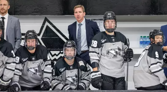 Nate Leaman on bench against Stonehill