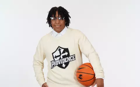 Assistant Coach Tiara Johnson poses for a casual photo during the program's annual preseason photoshoot