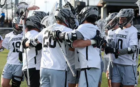 Men's lacrosse group huddle