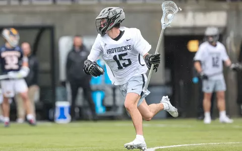 Ryan Bell cradles ball against Marquette