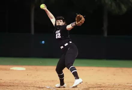 Emily Jonte pitching in softball game. 
