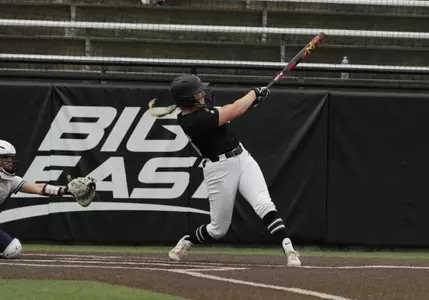 Jacque Harrington hitting in softball game