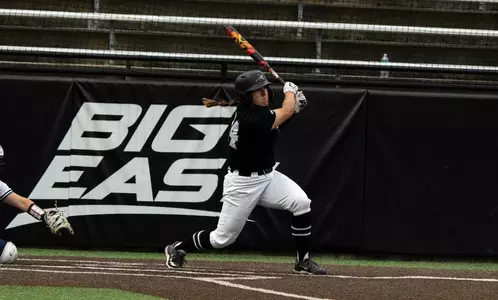 Lea Kosinski hitting in softball game