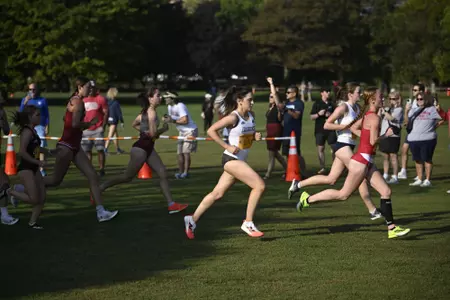 Cross Country athlete Jane Buckley running during the Lakefront Invitational