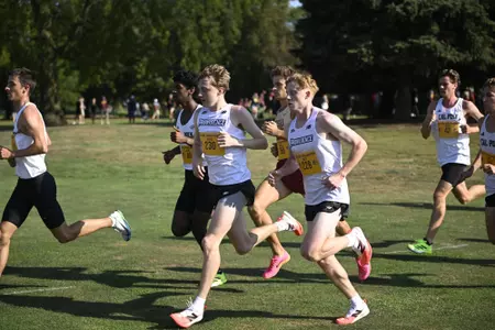 Cross country athletes Oliver Neate and Daniel Prescot running at the Sean Earl Loyola Chicago Lakefront Invitational