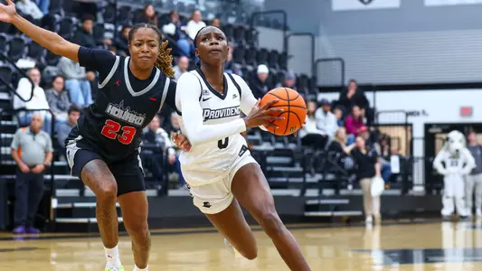 Sabou Gueye driving to the basket during a non conference match against Howard University