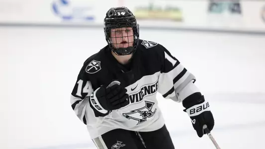 Women's ice hockey player Josie Lang defending during a game