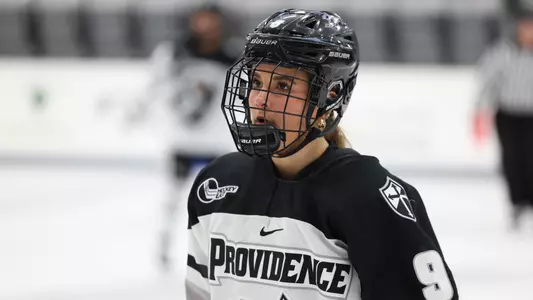 Women's ice hockey player Kiara Kraft skating during a media timeout
