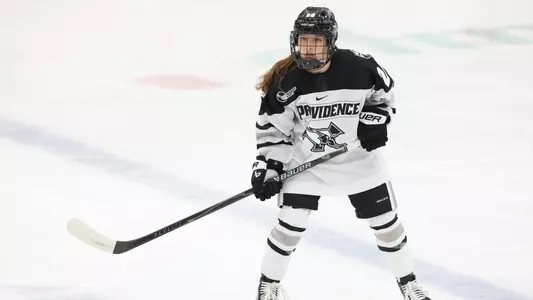 Women's ice hockey player Taylor Porthan skating during a game