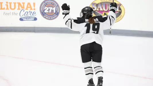 Women's ice hockey player Emma Hofbauer celebrating scoring a goal