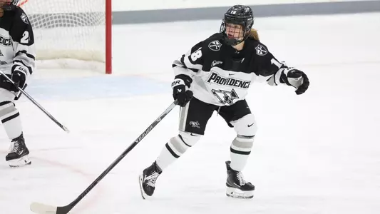 Women's ice hockey player Dylan Berman skating during a game