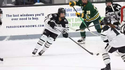 Women's ice hockey player Cristina Cavaliere skating with the puck
