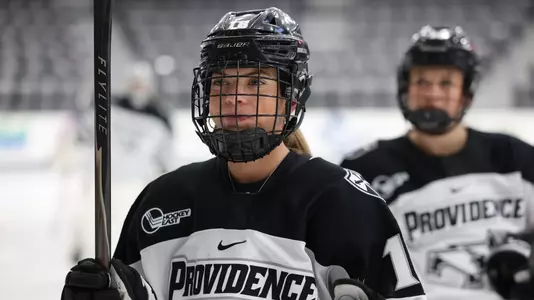 Women's ice hockey player Dylan Berman skating during warmups