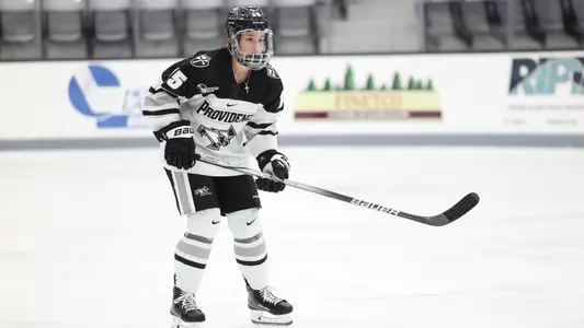 Women's ice hockey player Kayla Kutes skating during a game