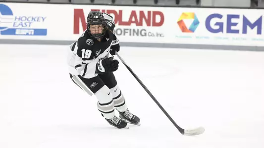 Women's ice hockey player Emma Hofbauer skating during a game