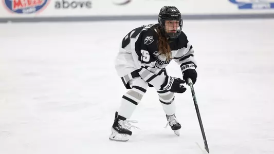 Women's ice hockey player Taylor Porthan defending during a game