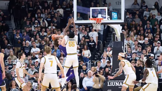 Oswin Erhunmwunse Men's Basketball contesting shot & block