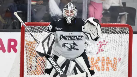 Women's ice hockey goalie Hope Walinski preparing to make a save during a game