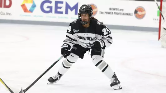 Women's ice hockey player Taylor Leemrijse defending during a game