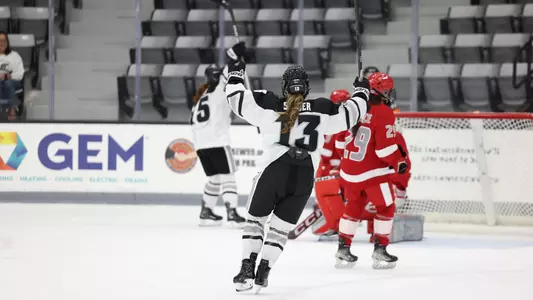 Women's ice hockey player Sami Snyder celebrating a goal during a game