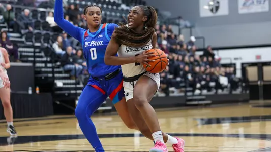 Grace Efosa Drives to basket against DePaul